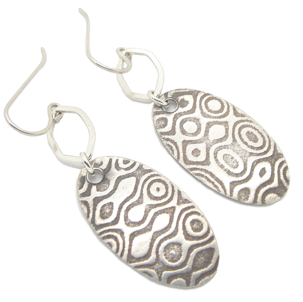 tribal or ethnic sterling silver earrings with stretched hexagon hoops
