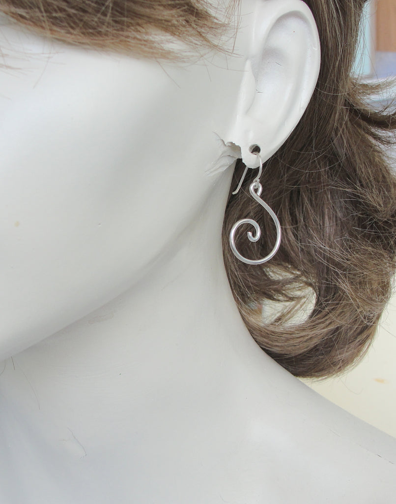 handmade heavy sterling silver spiral earrings on