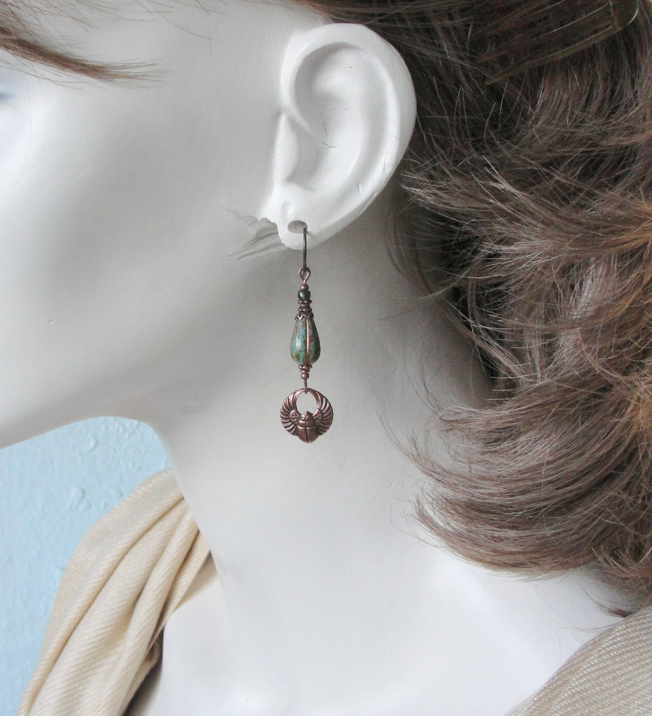 antiqued copper scarab earrings with turquoise blue green glass teardrop beads on