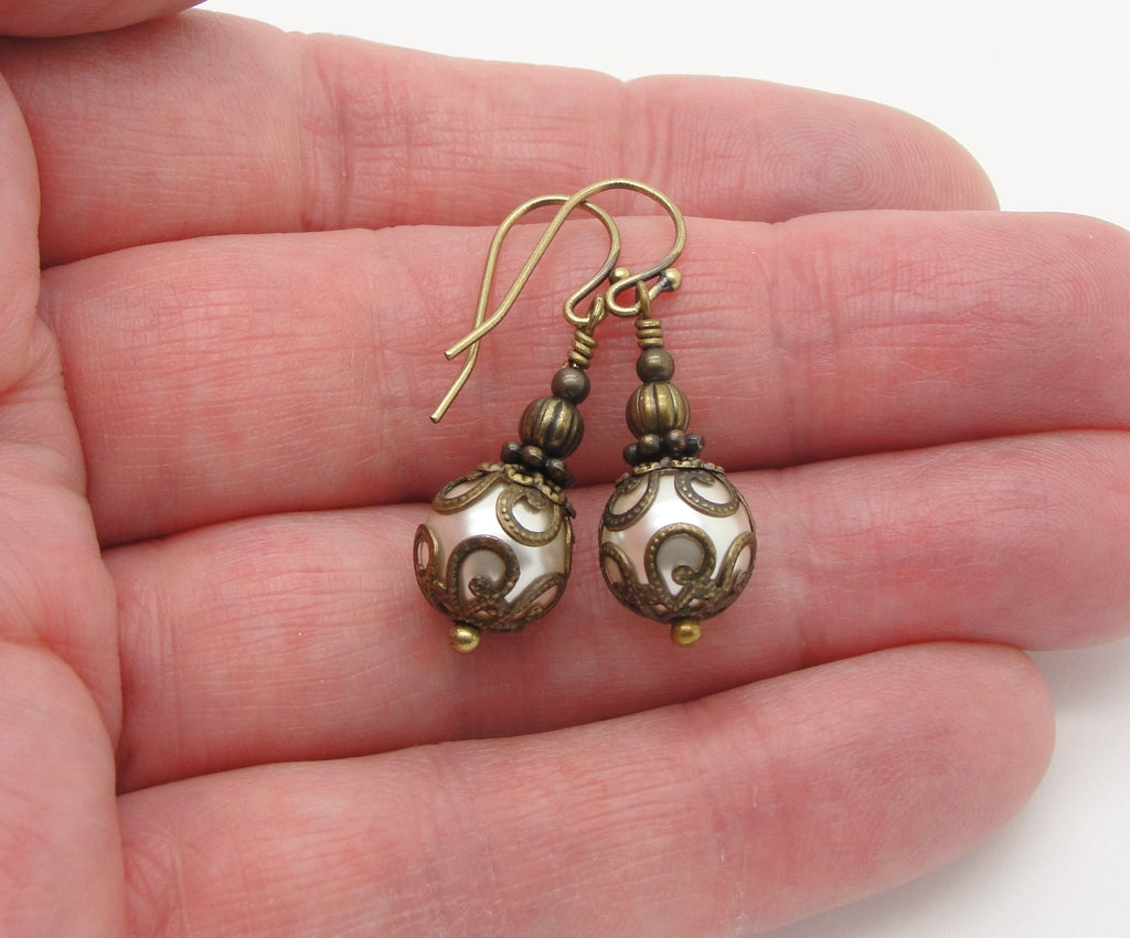 victorian cream pearl earrings in hand