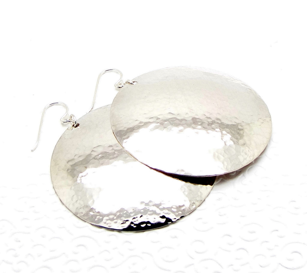 2 inch extra large sterling silver disc earrings laying flat