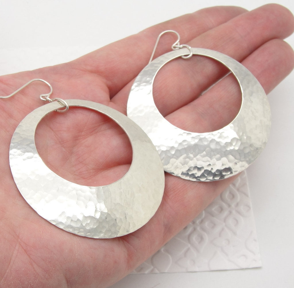 Extra Large Peephole Earrings in Hammered Sterling Silver Discs in 2 Inch Diameter Size in hand