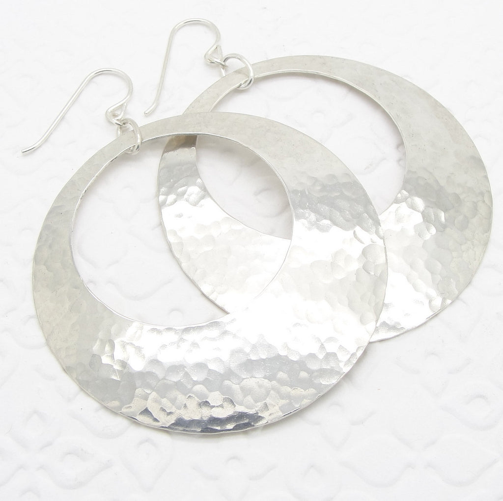 Extra Large Peephole Earrings in Hammered Sterling Silver Discs in 2 Inch Diameter Size close up by Cloud Cap Jewelry