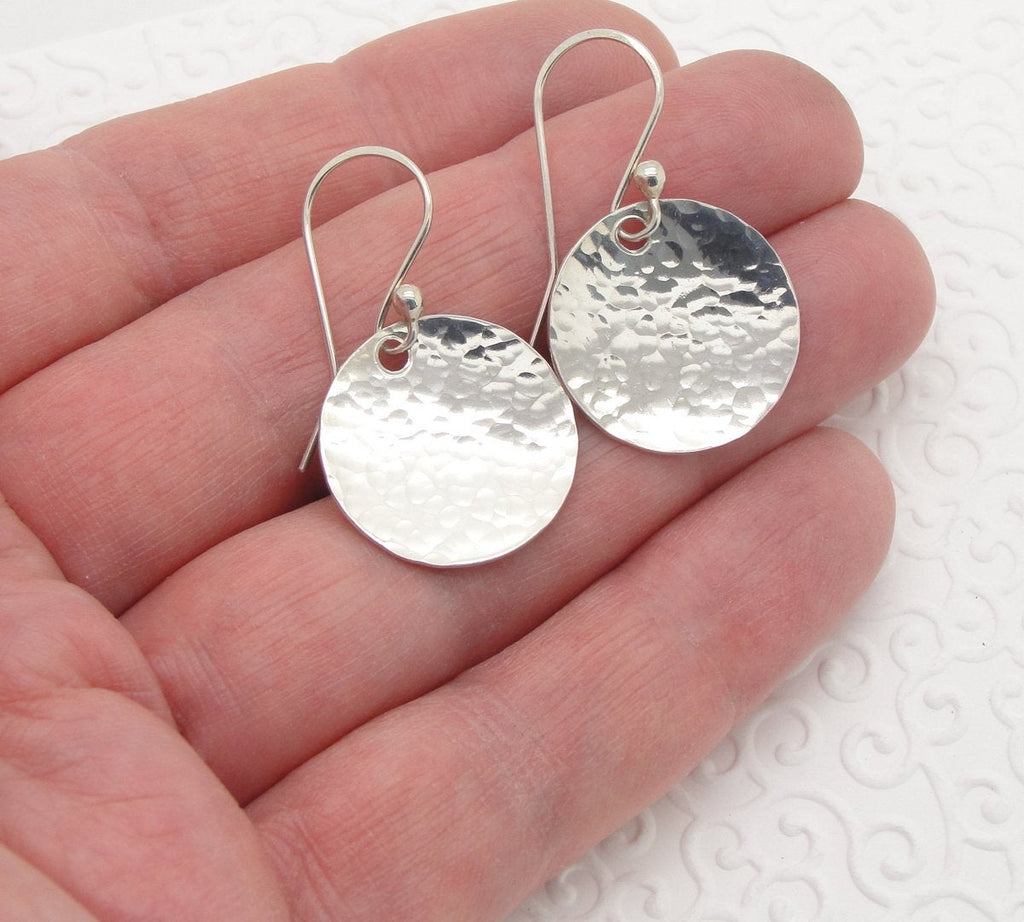 Small 3/4 Inch Disc Earrings in Hammered Sterling Silver that are Slightly Dish or Bowl Shaped  hand
