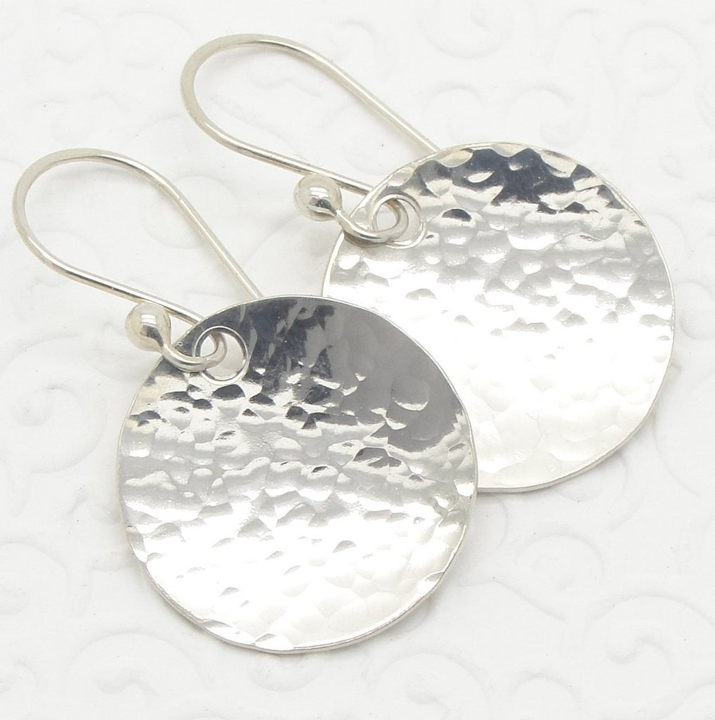 Small 3/4 Inch Disc Earrings in Hammered Sterling Silver that are Slightly Dish or Bowl Shaped  close