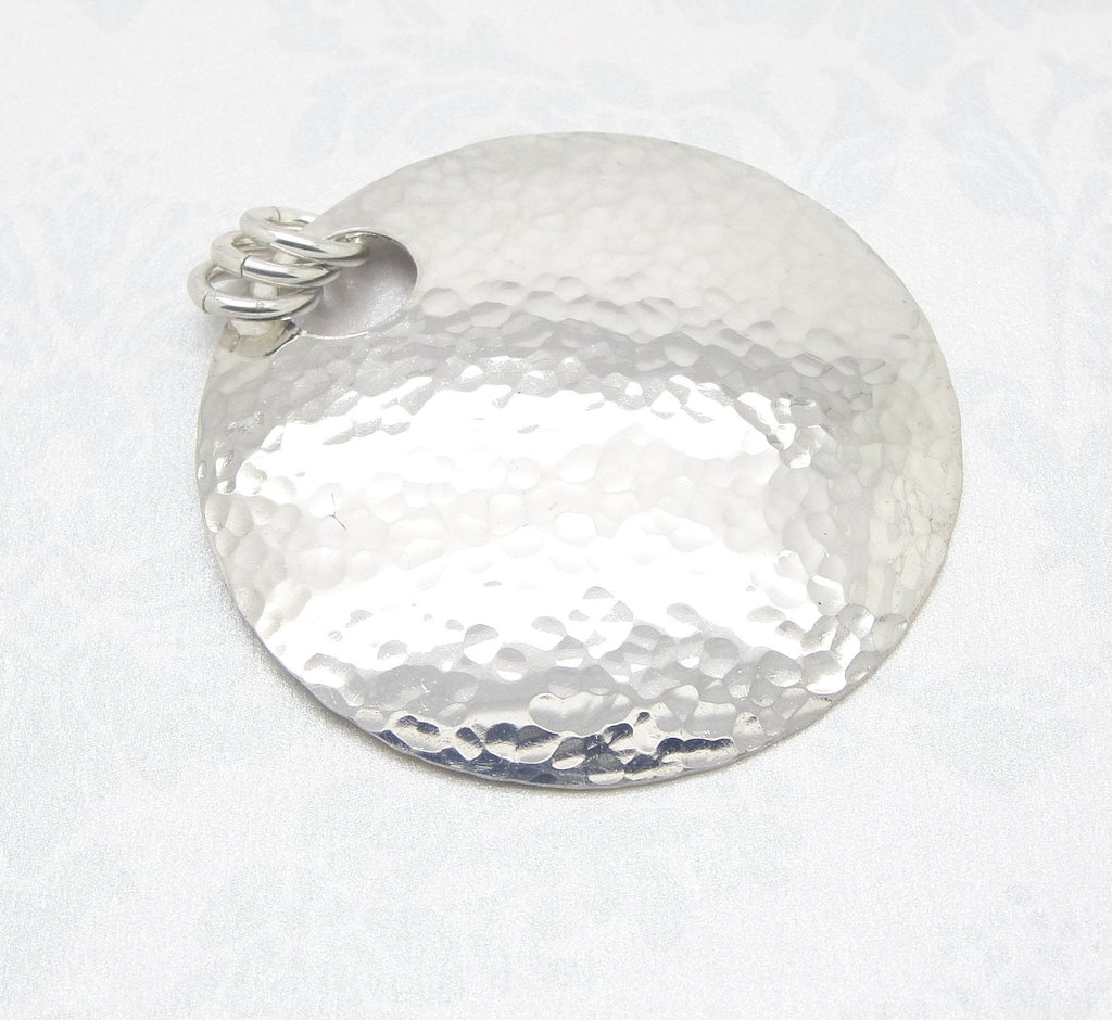 Large 1 1/2 Inch Disc Pendant in Hammered Sterling Silver with Small Peephole with three jump rings