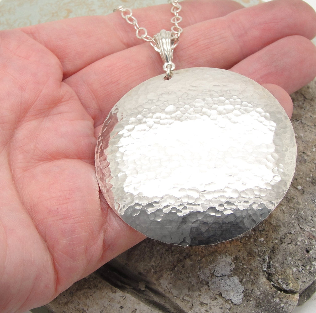 Extra Large Sterling Silver 2 Inch Disc Necklace with Chain and Hammered Finish in hand