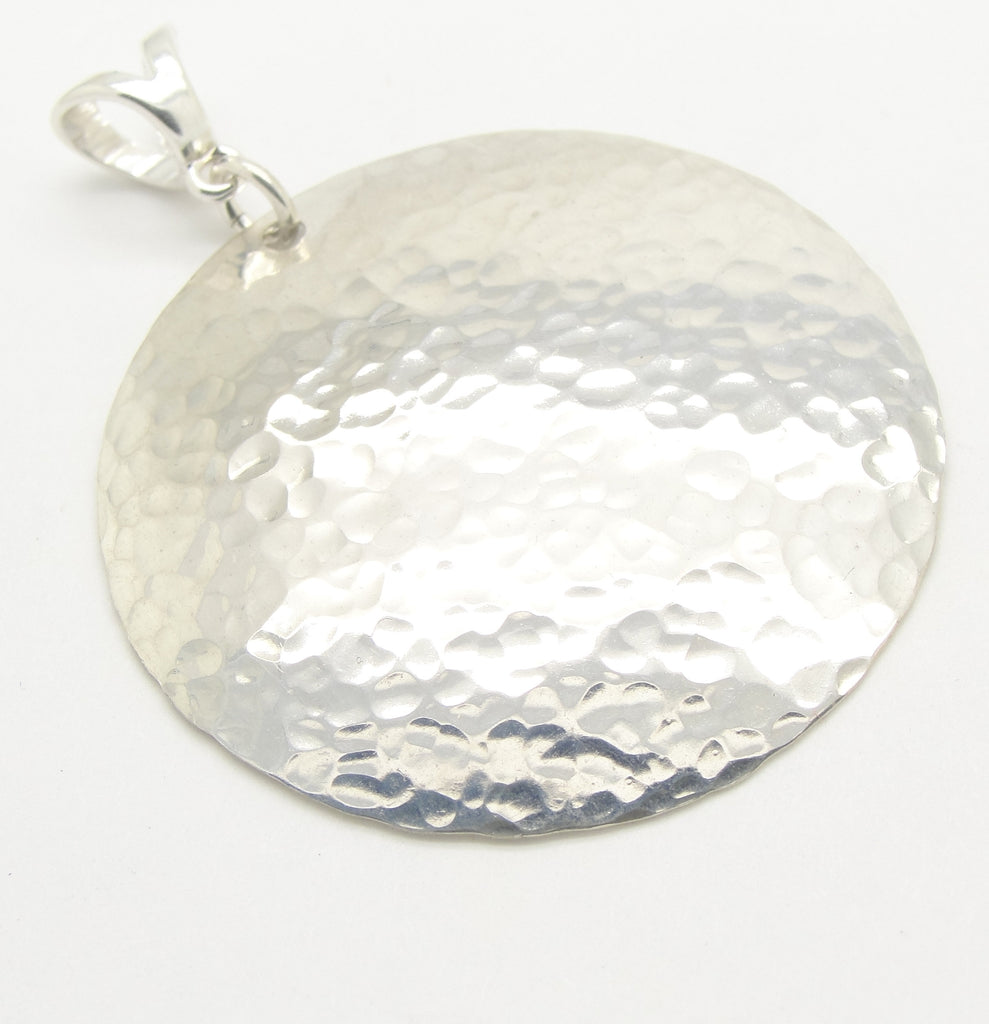 Large Disc Pendant in Hammered Sterling Silver in the 1 1/2 Inch Diameter by Cloud Cap Jewelry close up