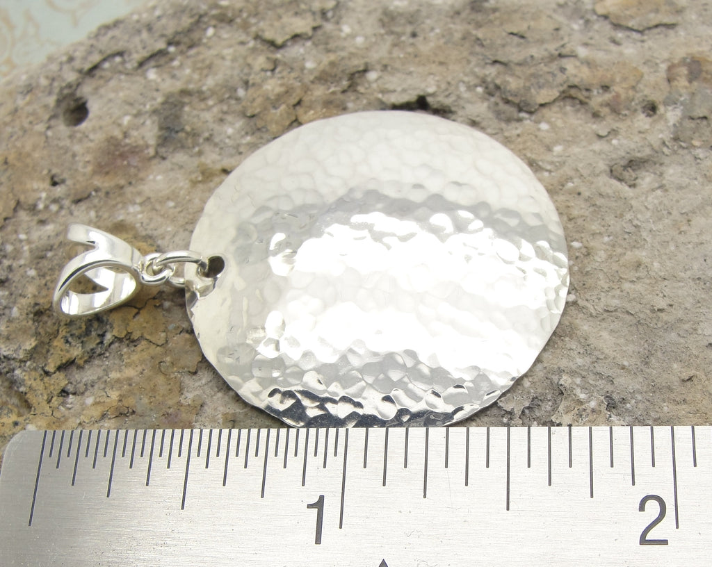 Large Disc Pendant in Hammered Sterling Silver in the 1 1/2 Inch Diameter by Cloud Cap Jewelry with ruler