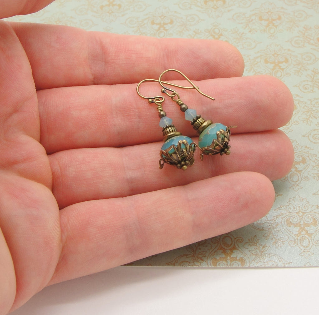 earrings held in hand