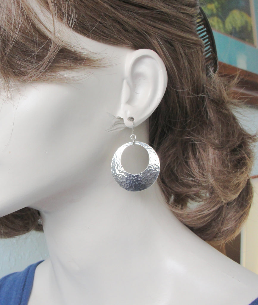 medium large 1 1/4 inch earrings in sterling silver with peepholes on